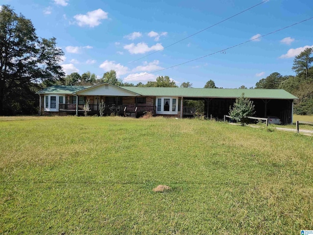 view of front of house featuring a front yard and a carport