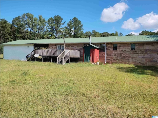 rear view of house with a lawn