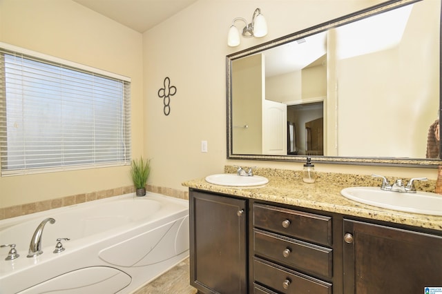 bathroom with vanity and a bathtub