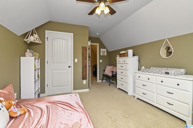 bedroom with light carpet, vaulted ceiling, and ceiling fan