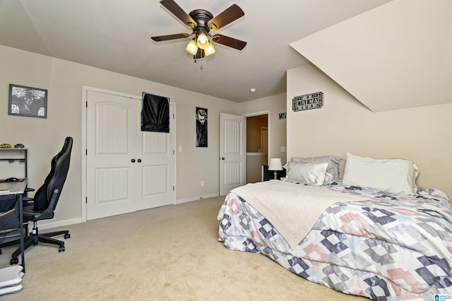 carpeted bedroom with ceiling fan and a closet