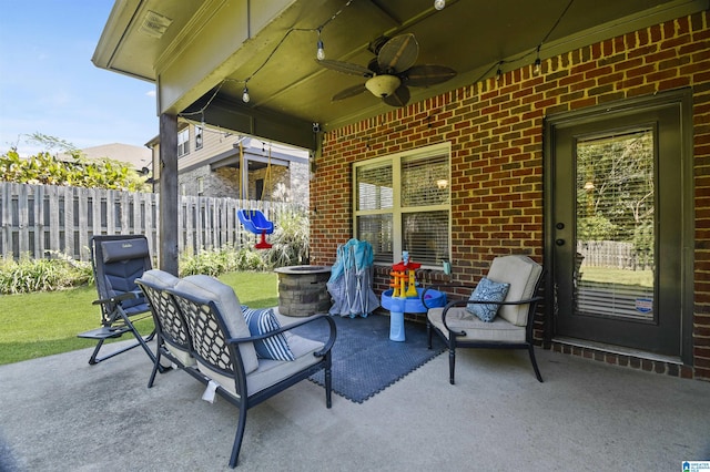 view of patio featuring ceiling fan