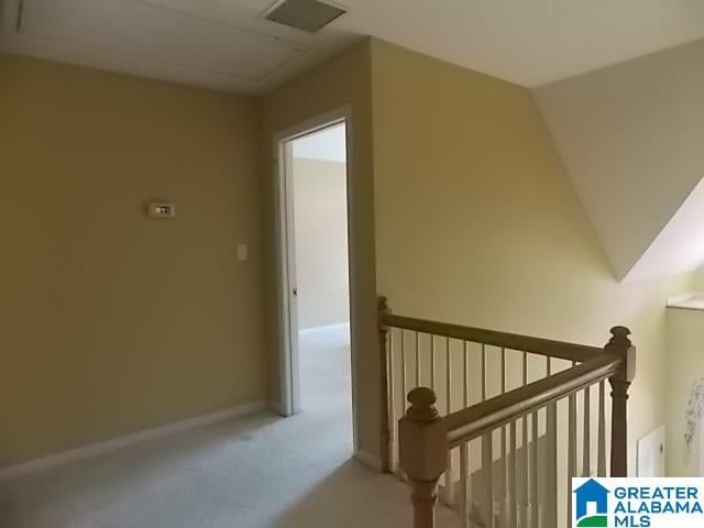 bonus room featuring lofted ceiling and carpet floors