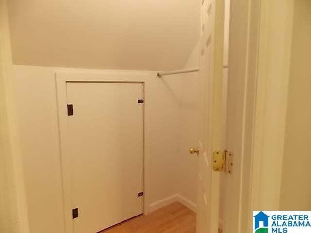 laundry room with hardwood / wood-style flooring