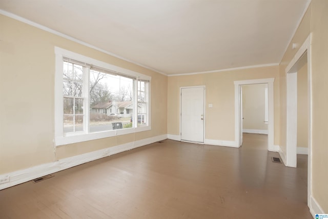 unfurnished room with crown molding and dark wood-type flooring