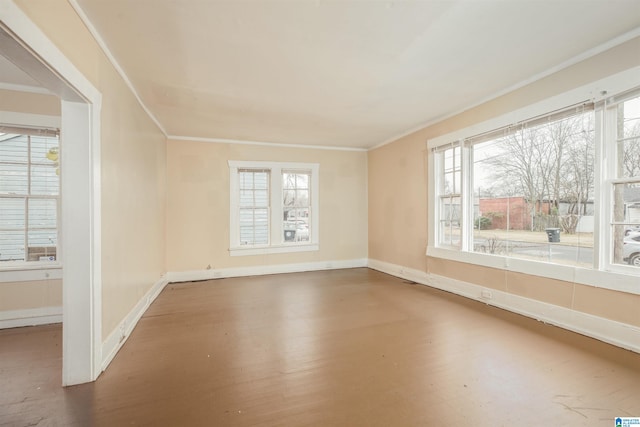 unfurnished room featuring hardwood / wood-style flooring and crown molding