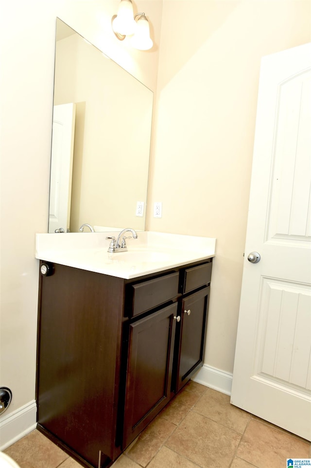 bathroom with tile patterned flooring and vanity