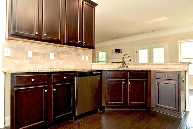 kitchen with kitchen peninsula, light stone counters, crown molding, dishwasher, and dark hardwood / wood-style flooring