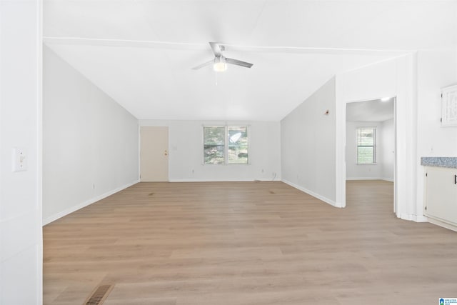 unfurnished living room with light wood-type flooring, lofted ceiling, and ceiling fan