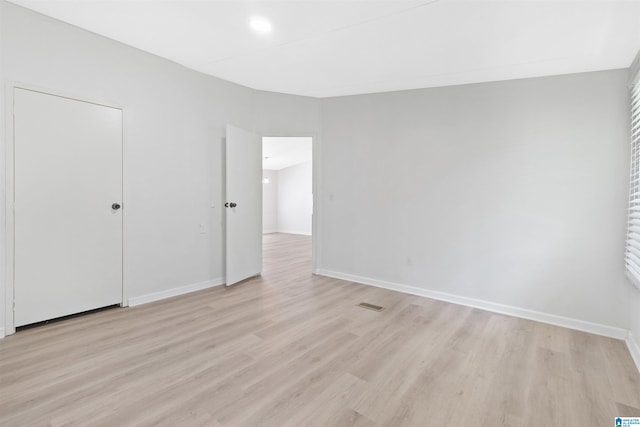 unfurnished bedroom featuring light wood-type flooring