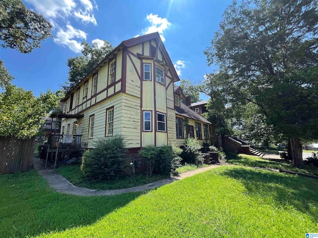 view of property exterior featuring a lawn