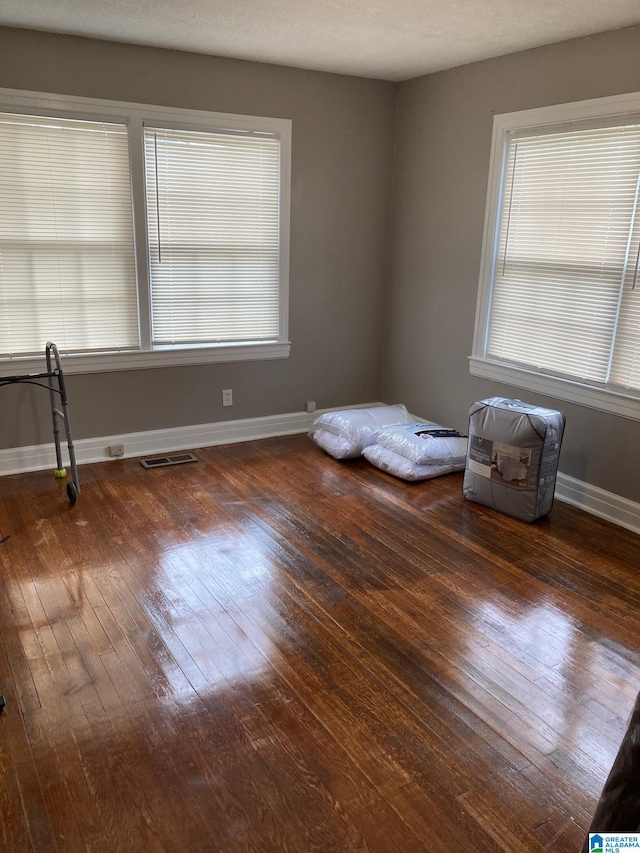 empty room featuring dark hardwood / wood-style floors