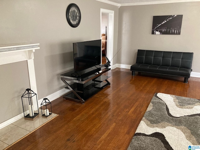 living room with ornamental molding and hardwood / wood-style flooring