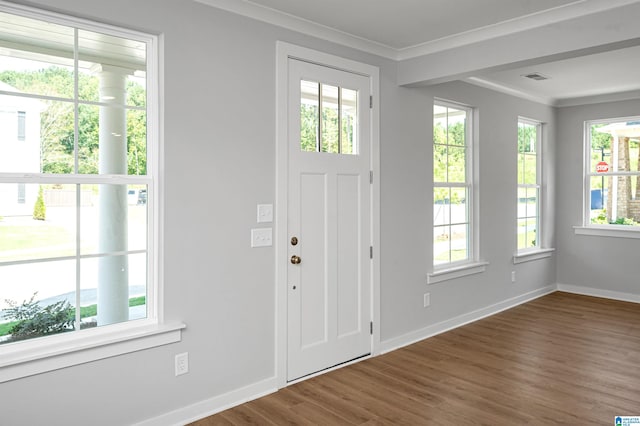 entrance foyer with crown molding and dark wood-type flooring