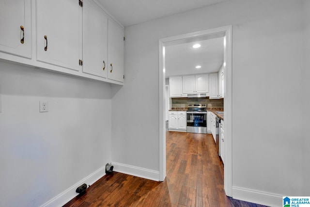 laundry area with dark wood-type flooring