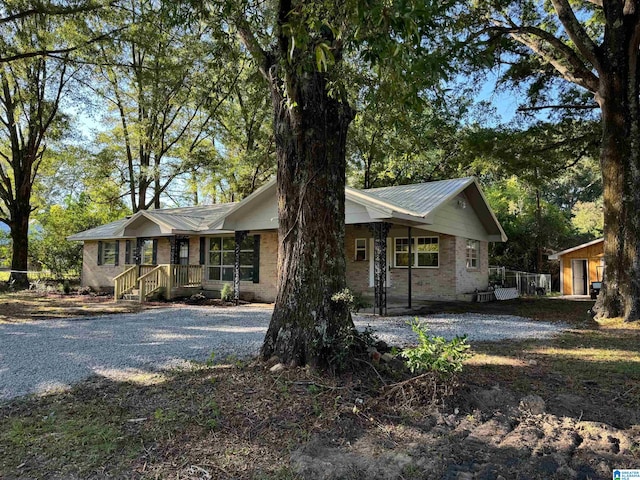 single story home featuring a porch