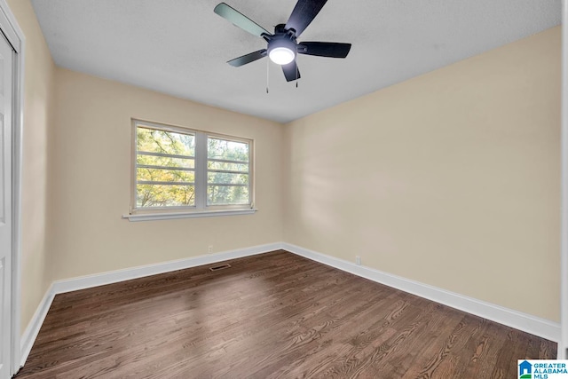 unfurnished room featuring hardwood / wood-style flooring and ceiling fan