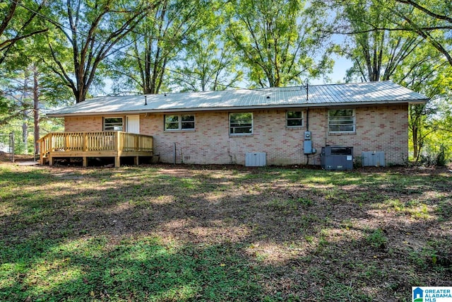 back of property featuring a deck and central AC unit