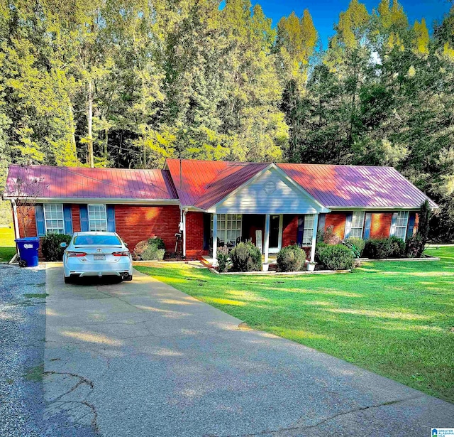 ranch-style home with a front lawn