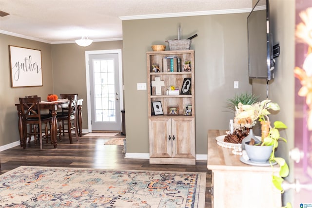 interior space featuring ornamental molding and dark hardwood / wood-style flooring