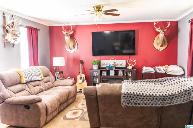 carpeted living room with ornamental molding and ceiling fan