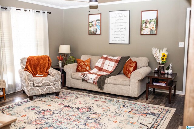 living room with ornamental molding, dark hardwood / wood-style flooring, and ceiling fan