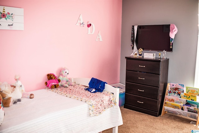 bedroom featuring light carpet