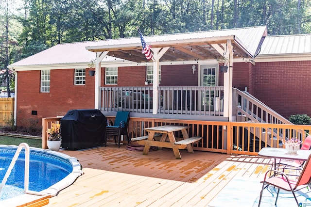 back of property with a pool side deck