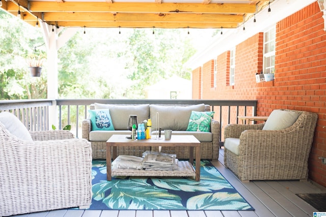 wooden balcony featuring outdoor lounge area and a deck