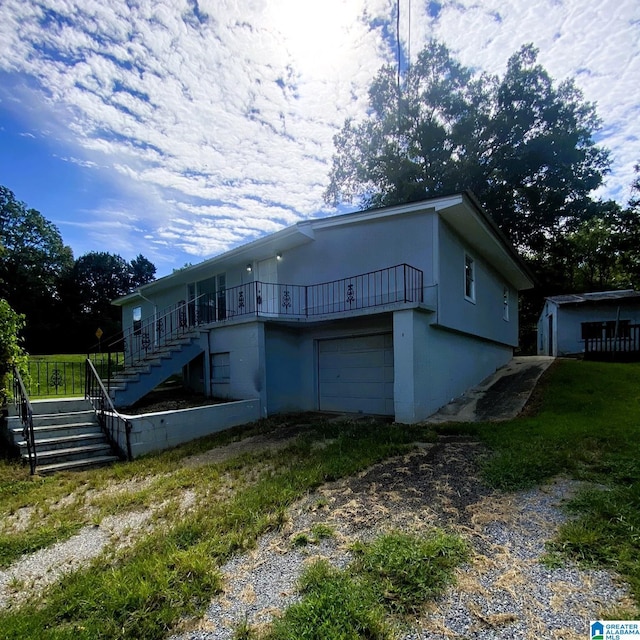 1121 Skyline Dr, Birmingham, AL 35214 - view of front of property with an attached garage, driveway, and stairs