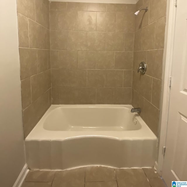 bathroom with tile patterned flooring and tiled shower / bath