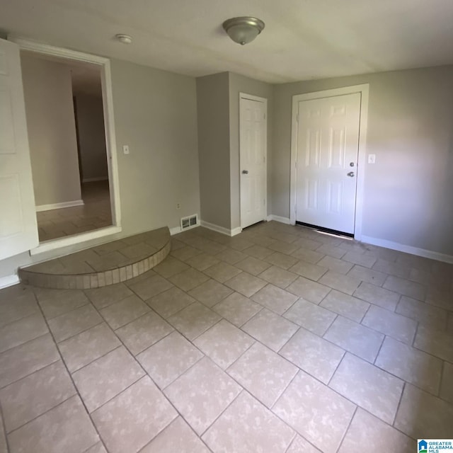 1121 Skyline Dr, Birmingham, AL 35214 - interior space featuring light tile patterned floors, visible vents, and baseboards