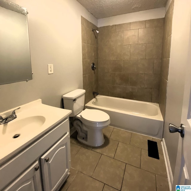 1121 Skyline Dr, Birmingham, AL 35214 - bathroom with a textured ceiling, vanity, tile patterned flooring, toilet, and shower / bath combination
