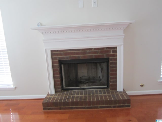 interior details featuring a fireplace and hardwood / wood-style flooring