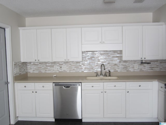 kitchen featuring backsplash, dishwasher, sink, and white cabinets