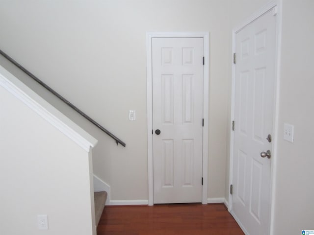 staircase with wood-type flooring