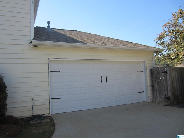 garage featuring wooden walls