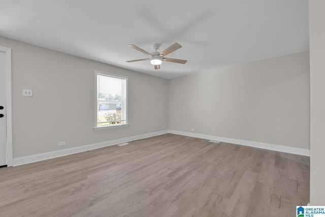 unfurnished room featuring ceiling fan and light hardwood / wood-style floors