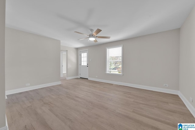 spare room featuring ceiling fan and light hardwood / wood-style floors