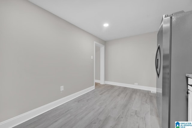 kitchen featuring stainless steel refrigerator and light wood-type flooring