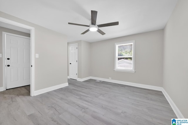 unfurnished room featuring ceiling fan and light hardwood / wood-style flooring