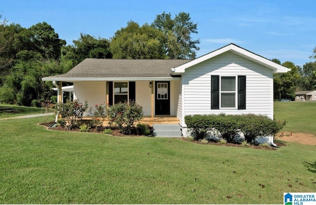 ranch-style house with a porch and a front lawn