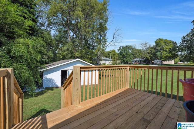 wooden terrace featuring a yard