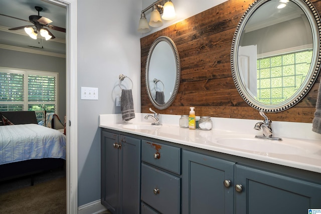 bathroom with wooden walls, vanity, and crown molding