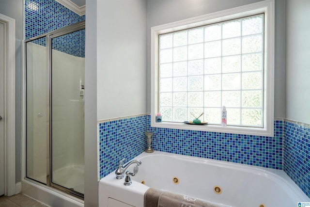 bathroom featuring shower with separate bathtub