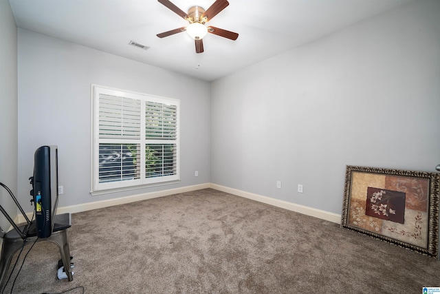 spare room with ceiling fan and carpet floors