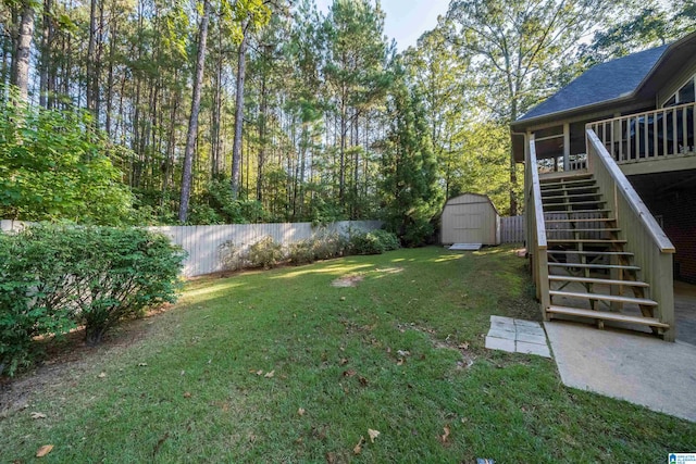 view of yard with a storage unit and a deck