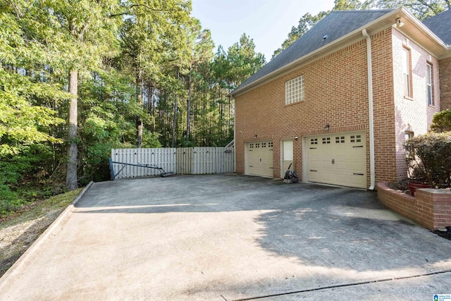 view of property exterior featuring a garage