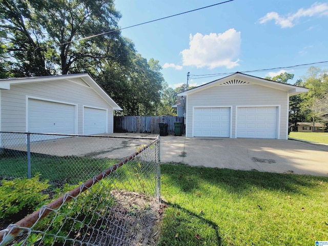 garage with a lawn