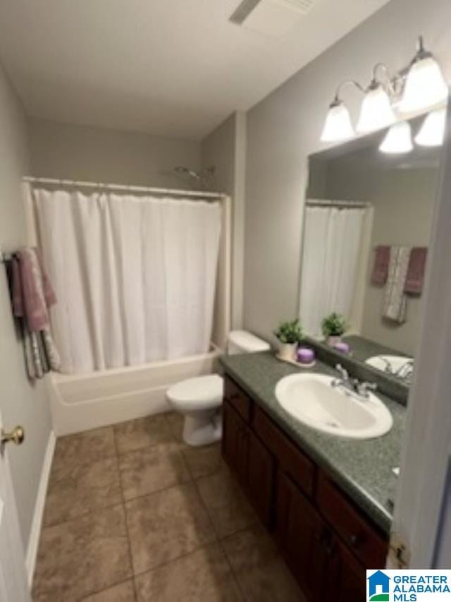 full bathroom with tile patterned flooring, vanity, shower / bath combination with curtain, and toilet